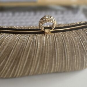 Elegant Gold Evening Clutch with Crystal Ring Closure